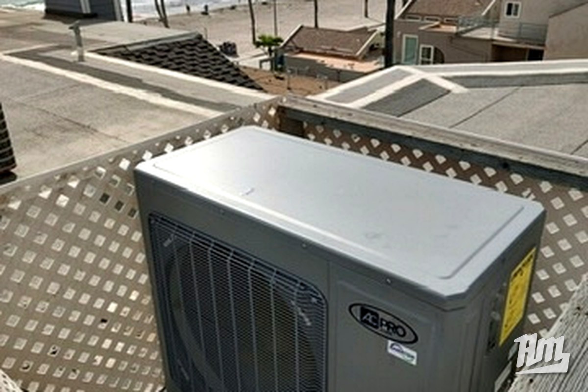 Residential AC installation with coastal view